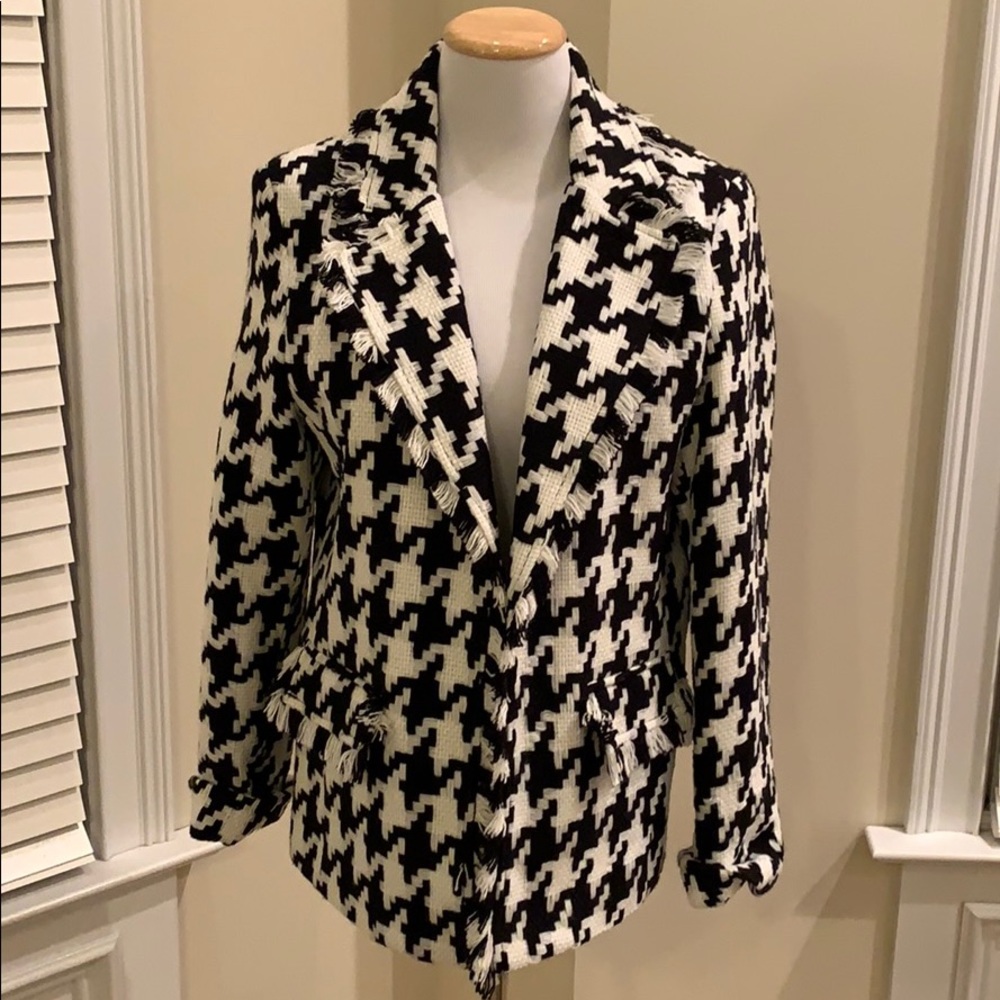 INVESTMENTS black and white jacket.